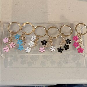 15 dollars Each. Fashion Jewelry Floral Keychain Set - Pink, Blue, White, Black